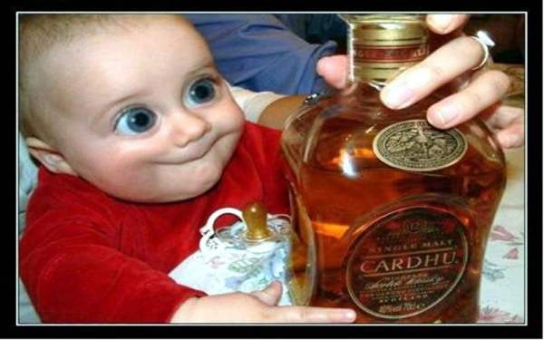 Funny Baby With Bottle of Alcohol