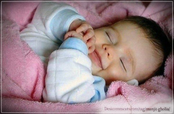 Baby smiling while sleeping