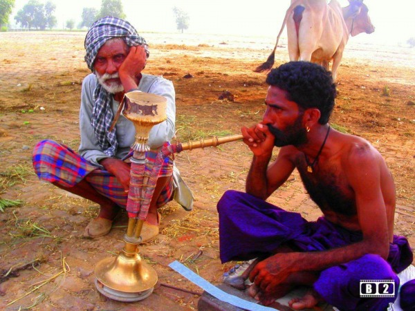 A Man Using Hukka