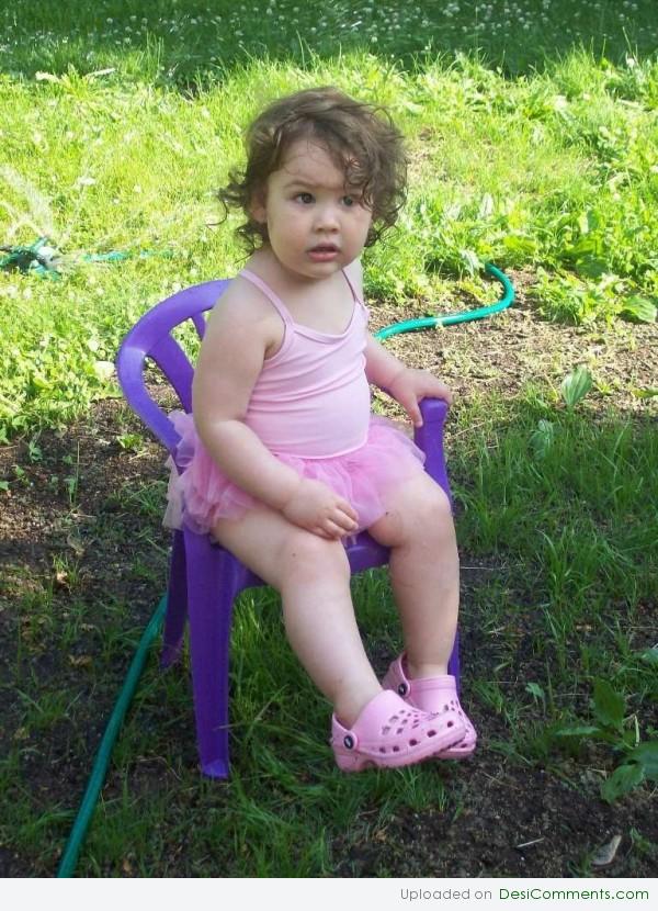 Baby Girl Sitting on Chair