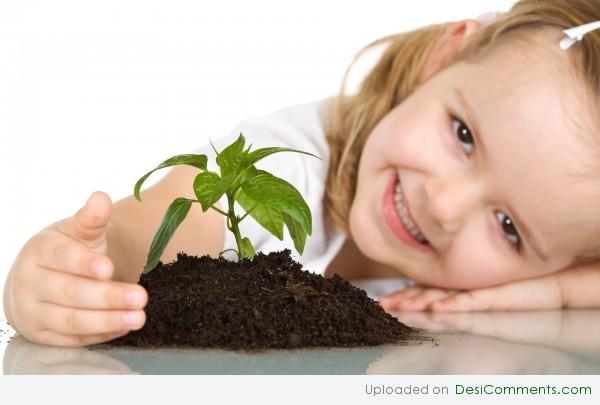 Baby Girl With Plant