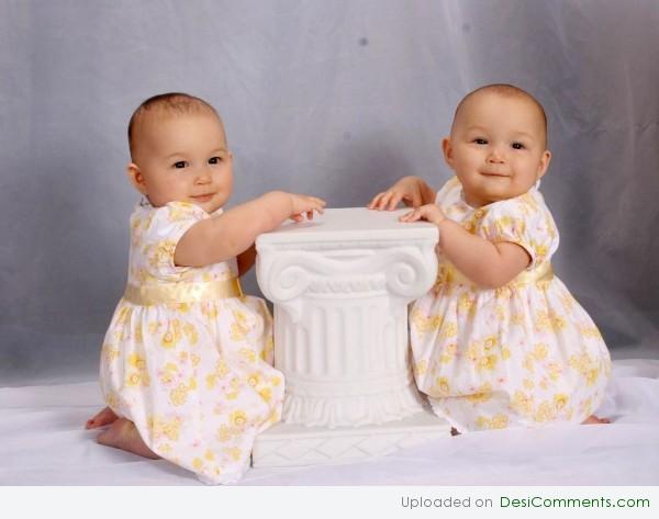 Cute Twin Baby Sisters