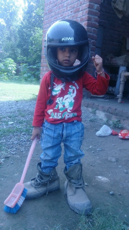 Indian baby wearing a helmet