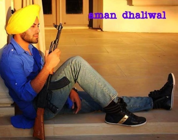 Aman Dhaliwal Holding A Gun