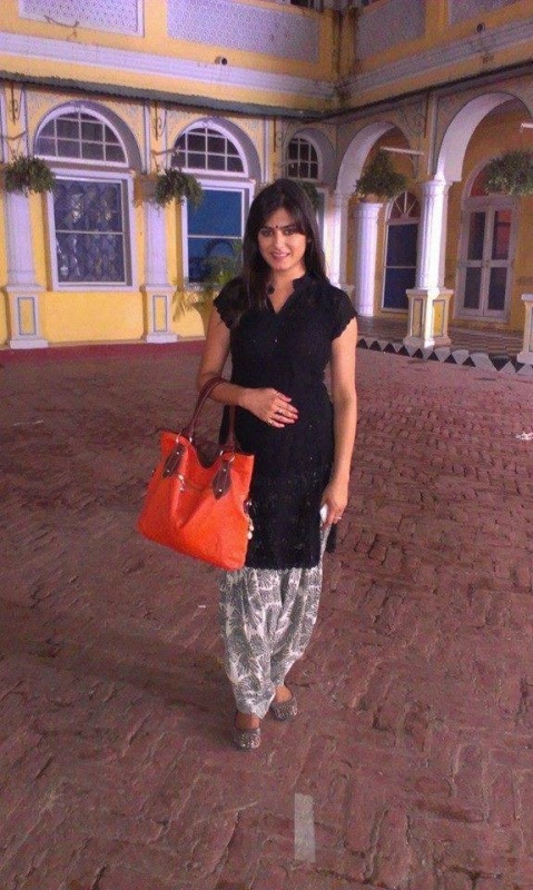 Anshu Sawhney Holding Orange Purse