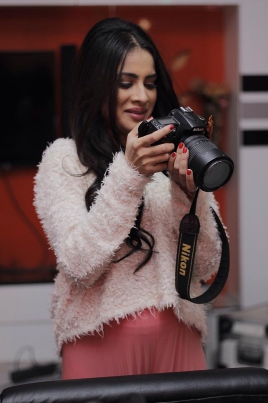 Sara Gurpal Holding Camera
