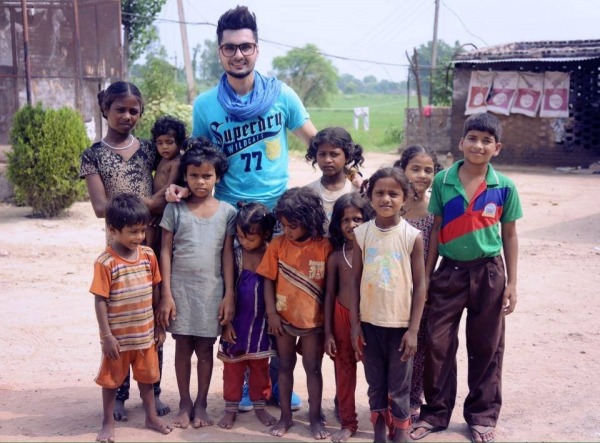 B jay randhawa With Poor Children