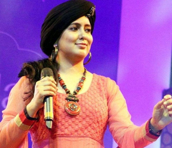 Harshdeep Kaur Holding Mic