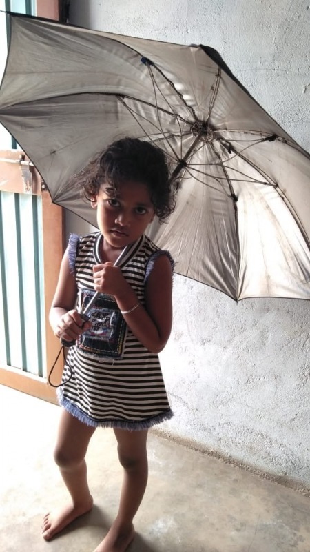 Cute Little Girl Holding Umbrella