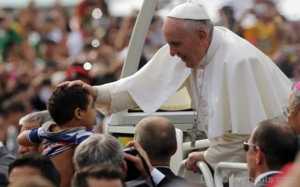 Pope Francis Blesses A Child During The World Youth Day