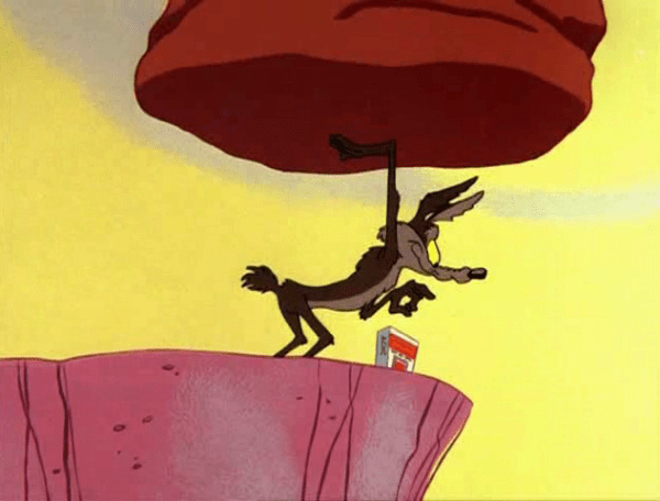 Wile E. Coyote Holding Rock