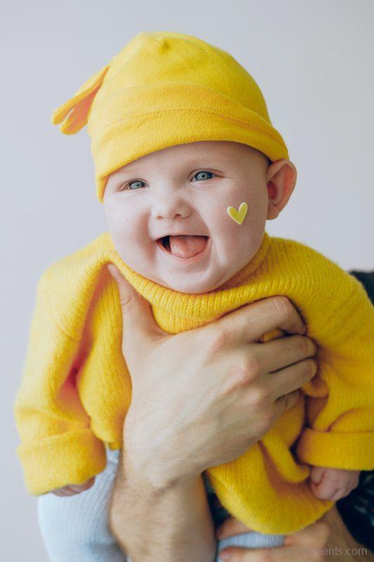 Baby In Yellow Outfit