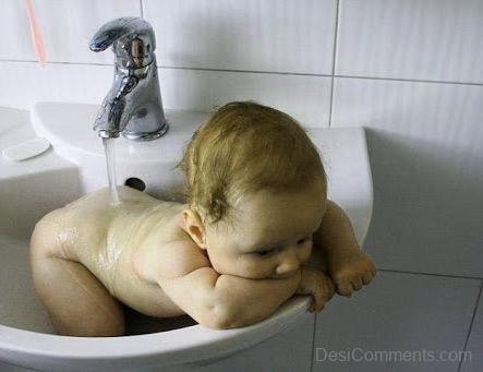 Baby Bathing In Sink