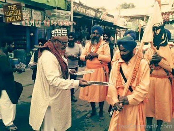 A Muslim Serving Food To Sikh People