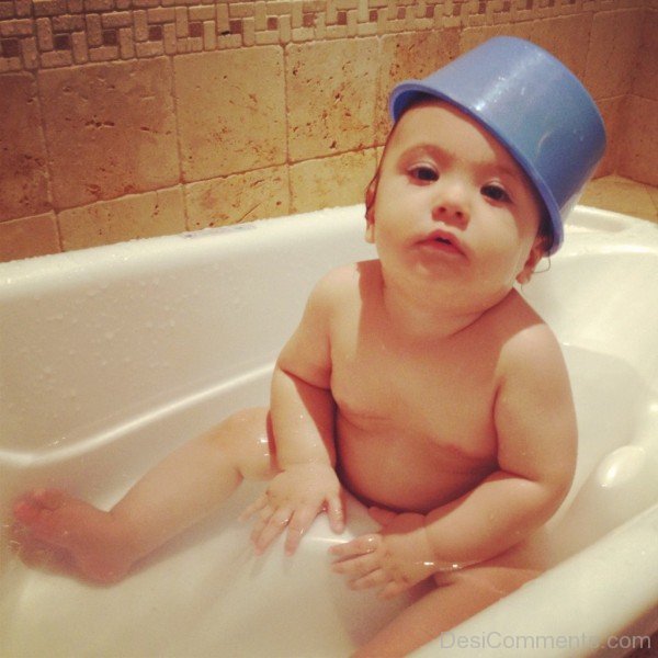 Adorable Baby Bathing In Tub