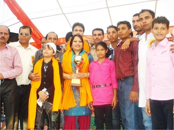 Amrita Virk Holding An Award