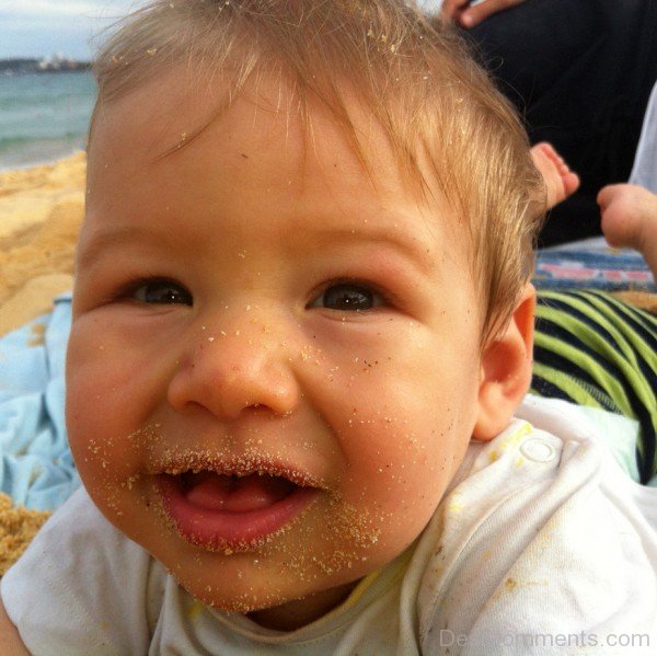Baby Eating Sand
