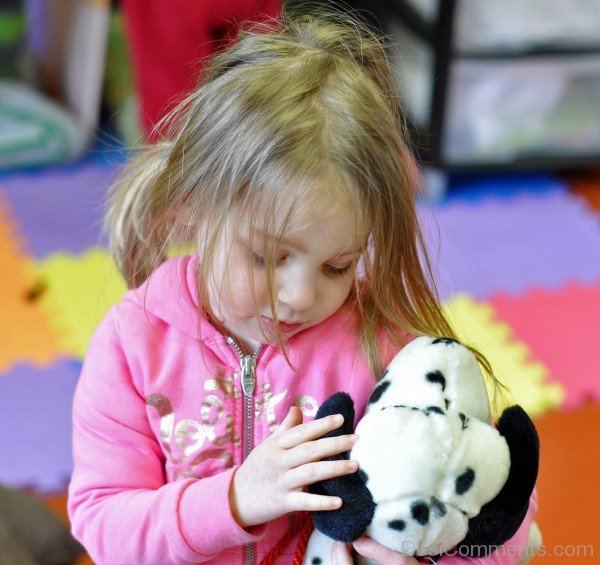 Baby Girl Playing With Toy