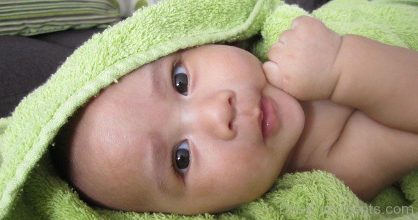 Baby In Green Towel
