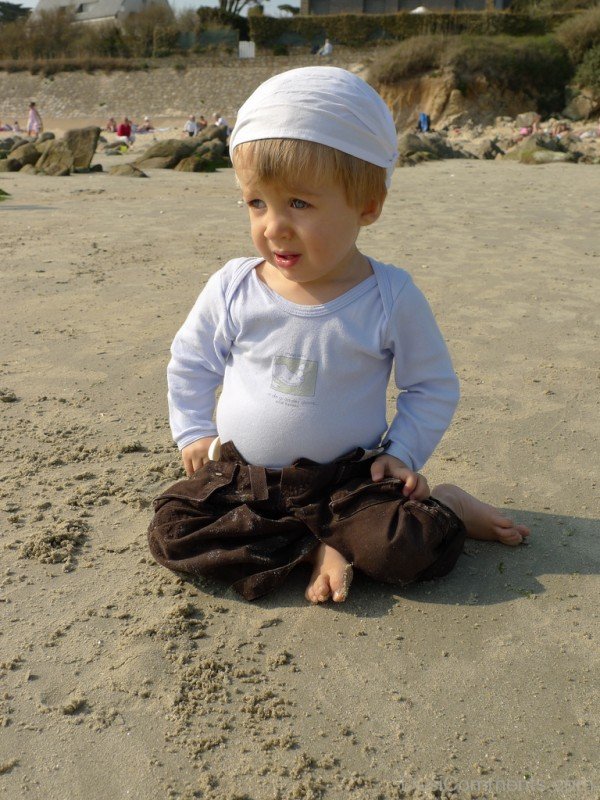 Baby Playing In Sand