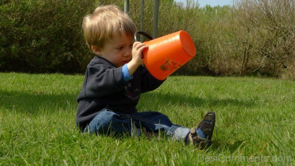 Baby Playing With Bucket