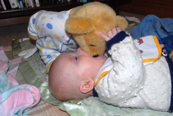 Baby Playing With Teddy