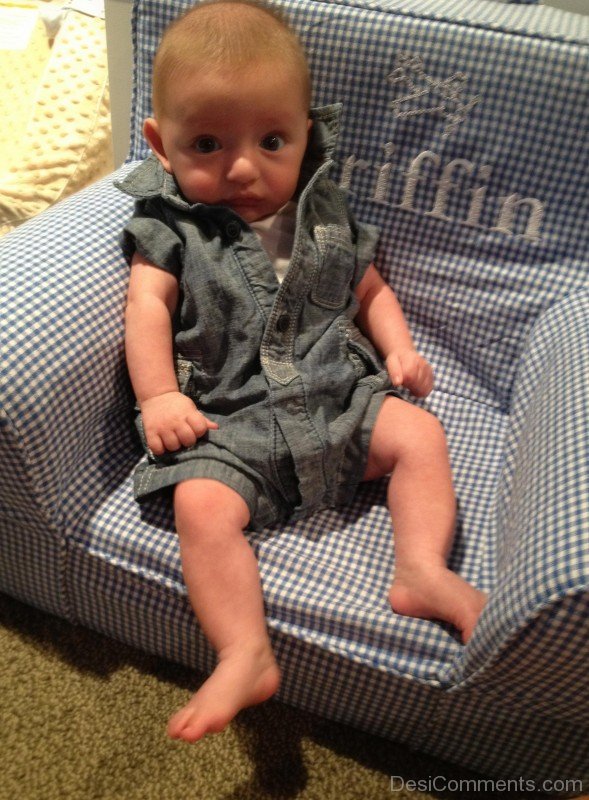 Baby Sitting On His Tiny Sofa