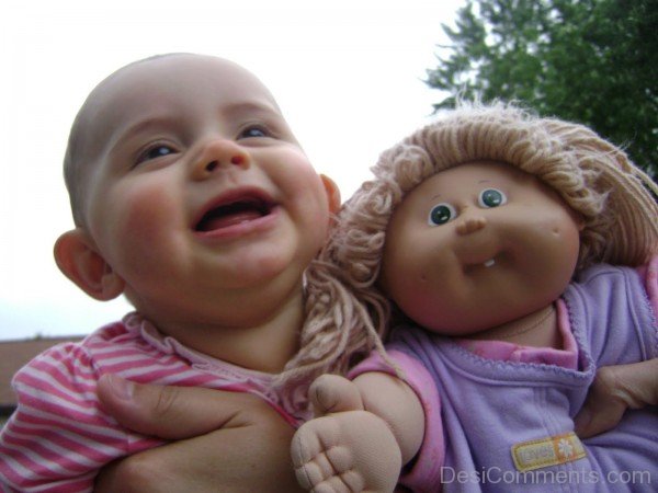 Baby Smiling With Teddy