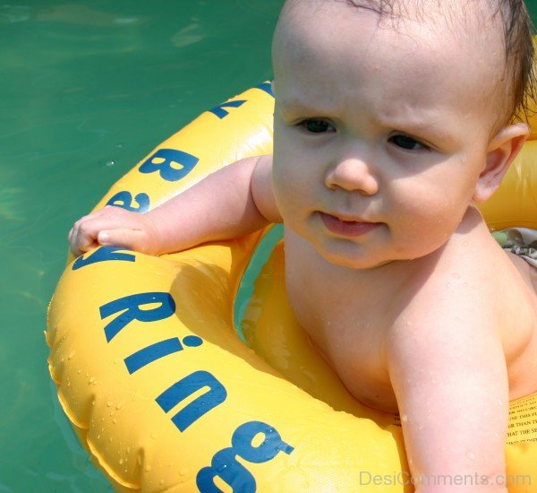 Baby Swimming In Pool