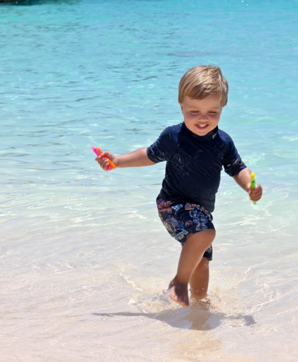 Boy Playing In Water