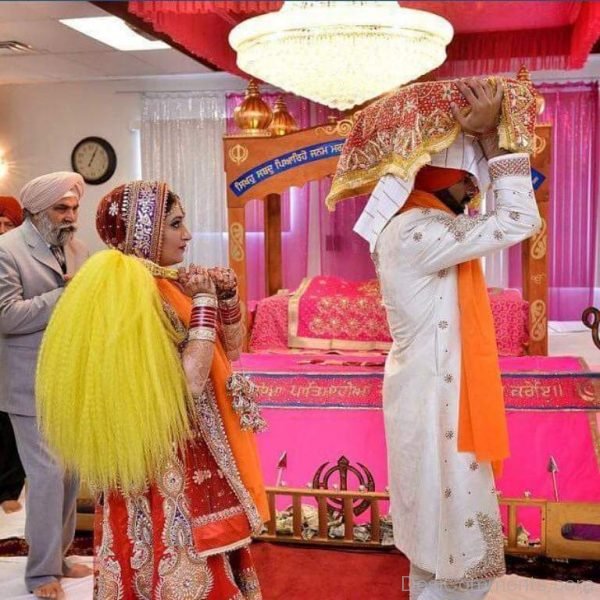 Couple With Guru Granth Sahib Ji