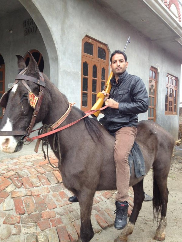 Eknoor Sidhu Posing With A Horse