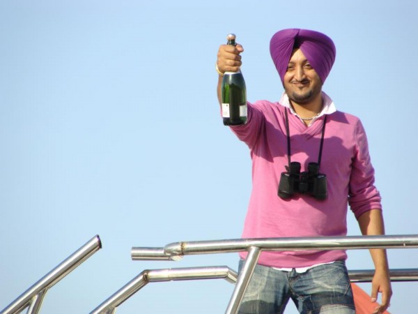 Inderjit Nikku Posing With Bottle