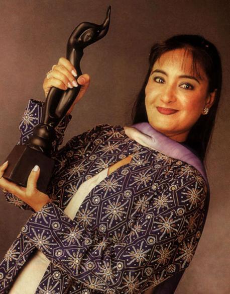 Jaspinder Narula Holding An Award