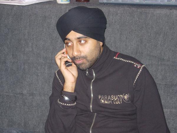 Jassi Sidhu Busy on Phone