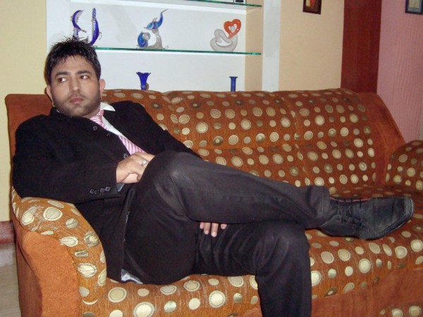 Mangi Mahal Sitting On Sofa