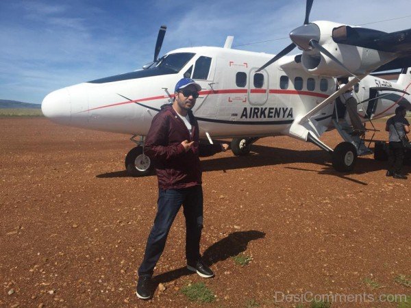 Mika Singh Posing With Glider Plane