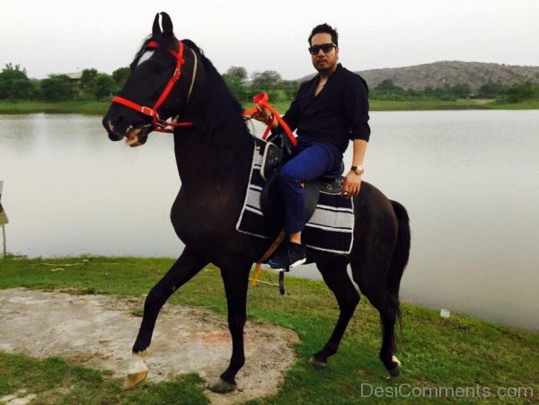 Mika Singh Sitting On Black Horse