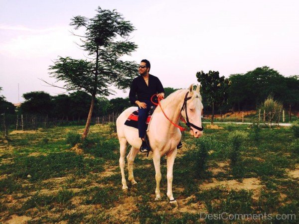 Mika Singh Sitting On White Horse