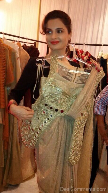 Monica Bedi Holding Dress