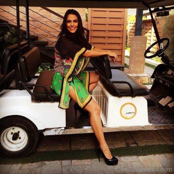 Neha Dhupia Sitting In Golf Buggy-DC02332