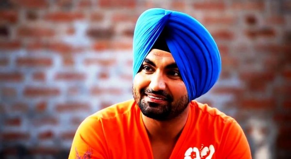 Ravinder Grewal Wearing Orange T-Shirt