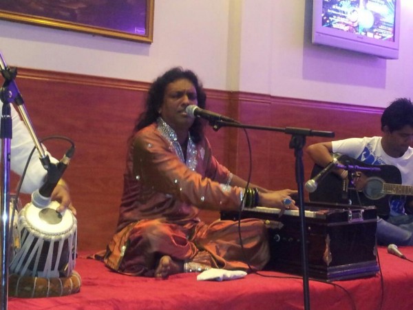 Sabar Koti is Playing Harmonium