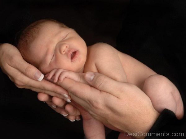 Baby Sleeping On Parents Hands