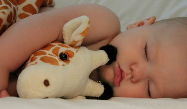 Baby With Giraffe Teddy