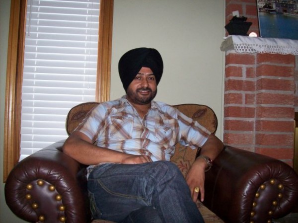 Surinder Laddi Sitting on Sofa