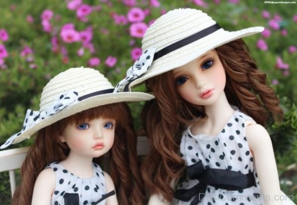Two Dolls Wearing Summer Hats